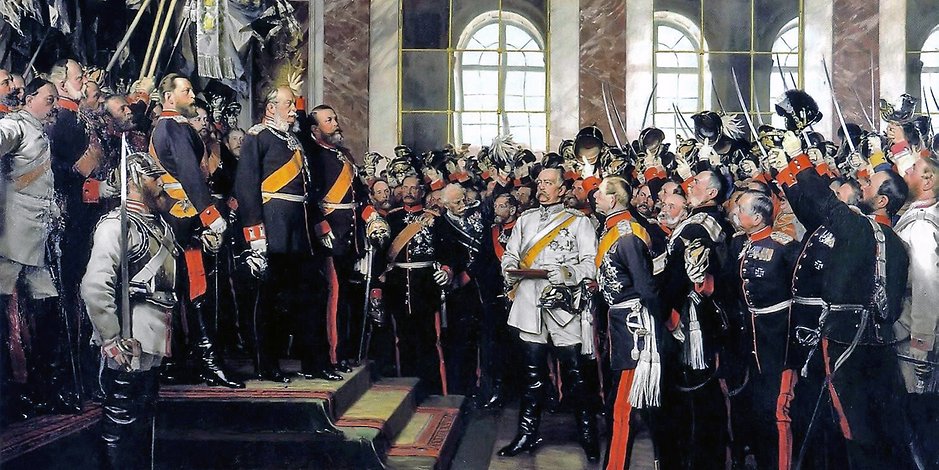 Eine Demütigung für Frankreich: Nicht in Berlin, nein, im Spiegelsaal von Versailles bei Paris wird Wilhelm I. zum deutschen Kaiser ausgerufen. Rechts von der Mitte in weißer Uniform: Otto von Bismarck.